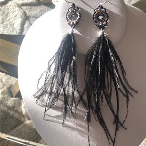 Ostrich feather long earrings.